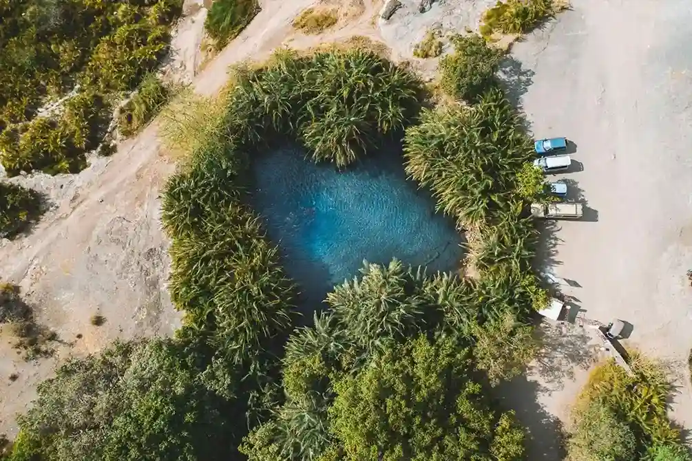 Crystal-clear turquoise pools at Chemka Hot Springs during day trip from Moshi